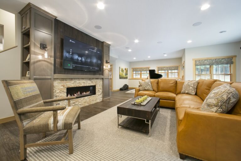 Modern living room with fireplace, TV wall, yellow armchair, and contemporary furniture